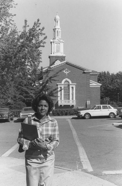 Unidentified, African American woman standing behind Memorial Hall, photographer: Student Affairs / Dean of Students