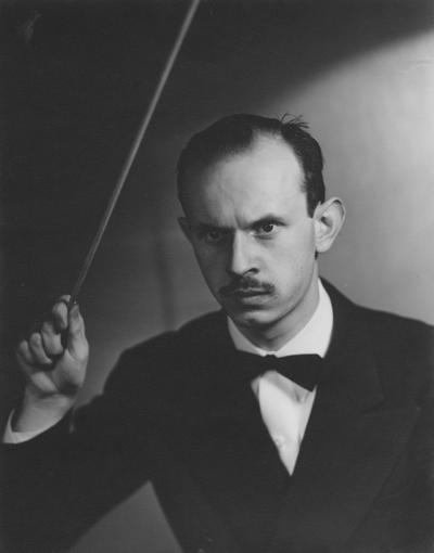 Longyear, Rey M., Musicologist, Professor, School of Music, 1964 - 1994, b. 1930 - d. 1995; posing with conductor's baton (second pose)