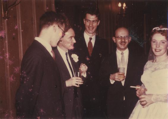 Longyear, Rey M., Musicologist, Professor, School of Music, 1964 - 1994, b. 1930 - d. 1995; pictured second from right with spouse, Katherine, apparently at their wedding; other individuals not identified