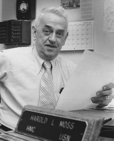 Moss, Harold, sits at his desk in the Medical Center
