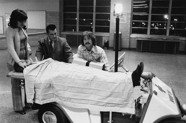 Carey, William J., Director of Emergency Services, University Hospital, pictured with Marilyn Schmidt (left) and Steve Gambaro (right), demonstrating emergency cart