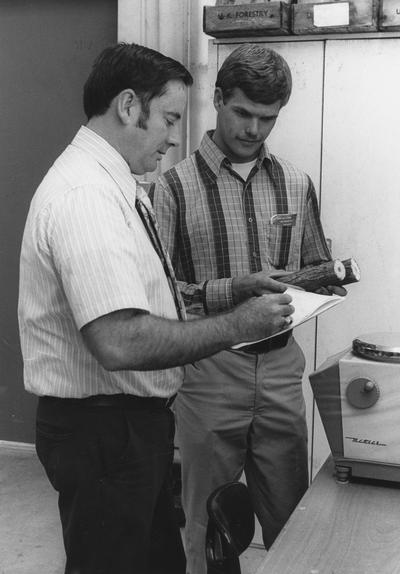 Carpenter, Stanley B., Professor of Forestry, College of Agriculture, pictured with unidentied student (right), University Information Services photograph