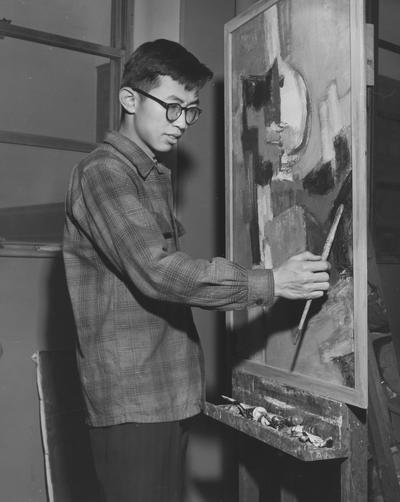 Chou, Ju - Hsi, Alumnus,, Art, pictured working on a painting, Public Relations Department