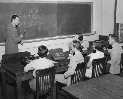 Christian, Virgil, Professor, Economics, pictured teaching a class, Public Relations Department