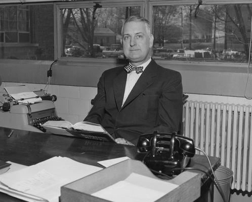 Clark, Thomas D., Alumnus, Master of Arts, 1929, Distinguished Professor, History Department, 1931 - 1968, Noted author and historian, Expert on Kentucky and Southern culture, Public Relations Department, pictured seated at desk in office