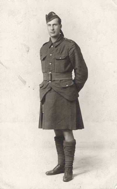 A postcard portrait of Lieutenant Wilfred Reddihough in a military uniform with a kilt. Reddihough lived in Lexington, Kentucky for a period of time before leaving for British Columbia and joining Company 2, Battalion 16 of the Canadian Scots. He was killed on the French battle front. This image was found pasted on the back of page 99 of 