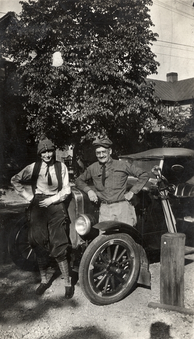 A portrait of Helen Cochran and Mr. E. C. Evans standing in front of a Ford Model A, which they called 