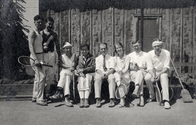 A group portrait of eight persons in tennis playing clothes and tennis rackets. Margaret Ingels is wearing a stripped skirt