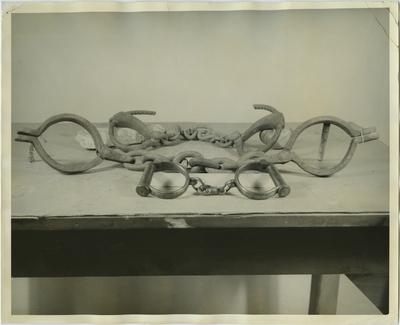 Slave handcuffs and leg irons; used as illustration facing page 242 in Coleman's 