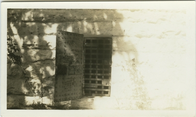 Locked doorway to unidentified brick building; same building pictured in item 34