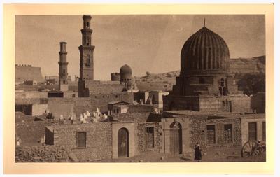 The large dome of a mosque is in the foreground with towers and domes of other buildings in the background