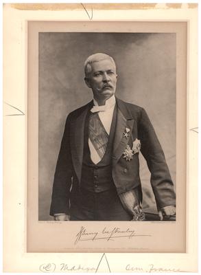 Portrait of Henry M. Stanley in dress clothes with medals, with printed autograph