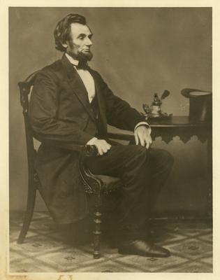 Portrait of Abraham Lincoln at a desk