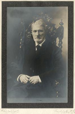 Portrait of Edwin Markham sitting in a chair