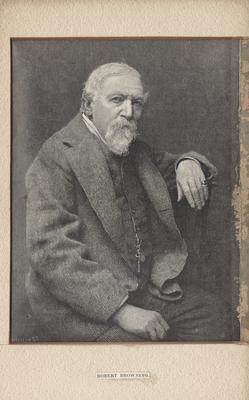 Portrait of Robert Browning, dressed in gray suit with key on vest