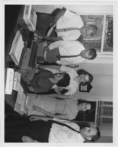 University of Kentucky housing personnel work on preregistration for the meeting of the American Society for Engineering; From left to right: Professor Edward E. Eisey, Dr. Merle Carter, Mrs. Sammye Rodgers, Catherine Whisenhunt, and Professor O. W. Steward