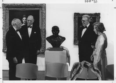 Armand Hammer, left, Bill Sturgill, second from left, and James Stewart, second from right, and Mrs. Armand Hammer admire the bust of Armand Hammer at the opening of the Armand Hammer exhibit in the Art Museum in the Singletary Center; James Stewart is the sculptor and Bill Sturgill was chairman of the University of Kentucky Board of Trustees
