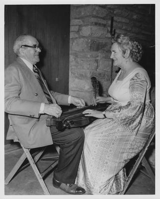 A man and woman with a dulcimer