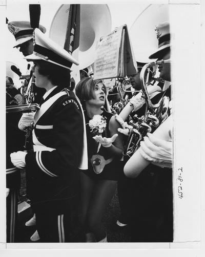 Flag bearer stands in the middle of band members; This image is on page 81 of the 1969 Kentuckian