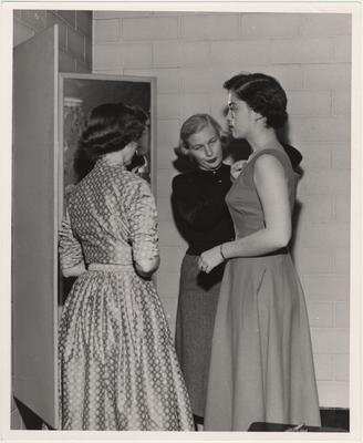A student gets fitted for a dress