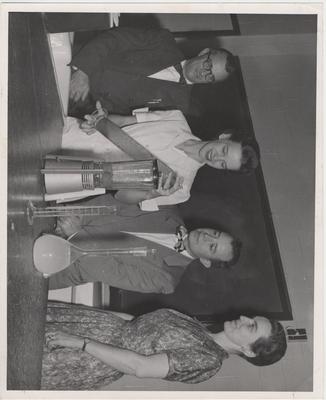Testing berries; From left to right: Carl Chaplin, Doris Tichenor, Dr. J. C. Rodriguez, and Dr. Abby Marlatt