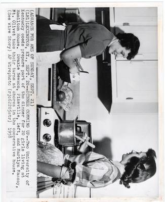 Preparing dinner for the girls at the Hamilton House are Draxie Newson (left) and Marilyn Massay (right); Associated Press wire photo