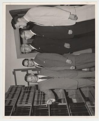 Dean W. L. Matthews with other unidentified men