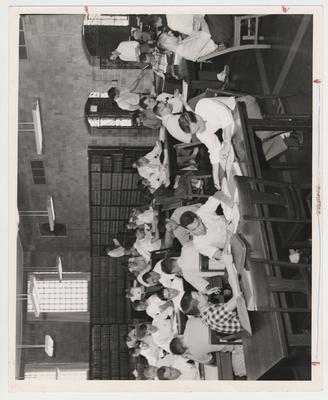 Students study in the Law Library; Luther House, front left, in plaid shirt