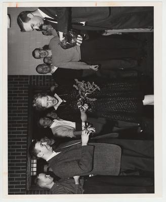 Mary Dunne being presented a corsage by the College of Law students