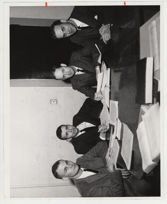 The editorial staff of the Kentucky Law Journal; From left to right: Robert G. Zweigart, Maysville, comment editor; K. Sidney Newman, Lexington, editor - in - chief; Thomas L. Jones, Greensburg, associate editor; and William M. Dishman, Danville, note editor