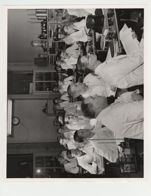 Pharmacy students listen to a lecture in the lab