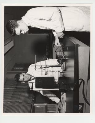 Pharmacy students Charles Wheeler (left) and Julian H. Mitchell (right) work in the laboratory