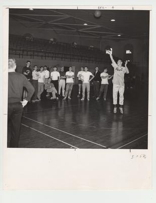 Students play basketball in the Alumni Gymnasium during a Physical Education class