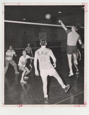 Men playing volleyball; Photographer: Ted W. Simmons