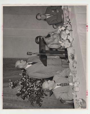 From left to right: Vice - President Dr. Leo M. Chamberlain, Louis Ware, speaker Mrs. Paul Blazer, and an unidentified man