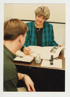 A women helps a student at Ashland Community College