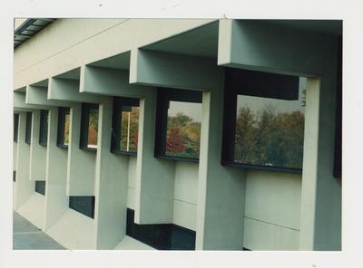 The windows of an unidentified building on the campus of Ashland Community College reflect the Fall foliage