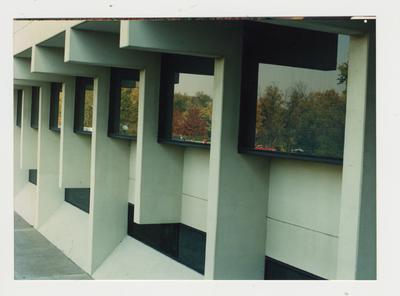 The windows of an unidentified building on the campus of Ashland Community College reflect the Fall foliage