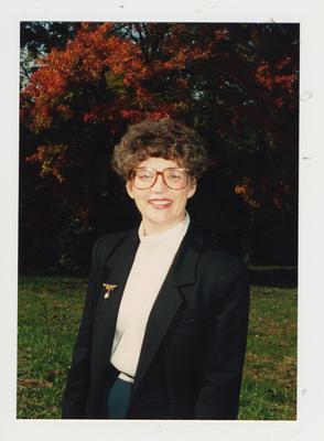 An unidentified woman framed by the Fall foliage