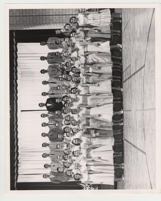 The Glee Club under the direction of Robert Knauf (top row center)