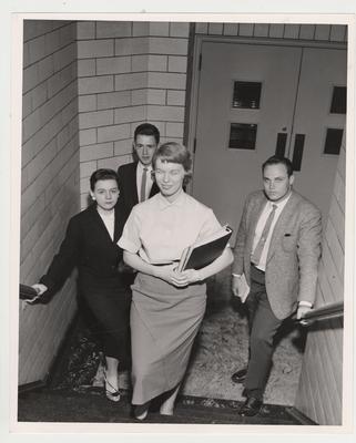 Students in a stairwell include: Sylvia Blythe, Carolyn Ward, and James Grosser