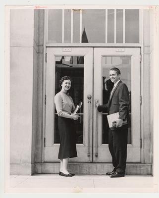 Marjorie Romaniwitz and Joseph Hill pose in front of a doorway