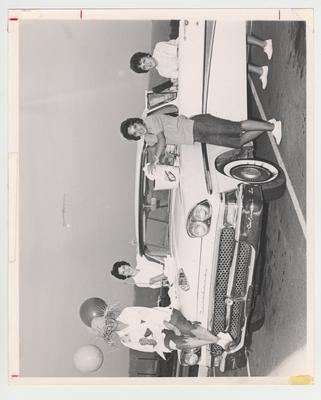 Members of the Upsilon Kappa Psi host a car wash