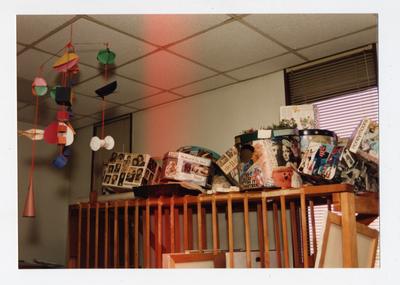 A color image of collage boxes and a mobile in an Art room