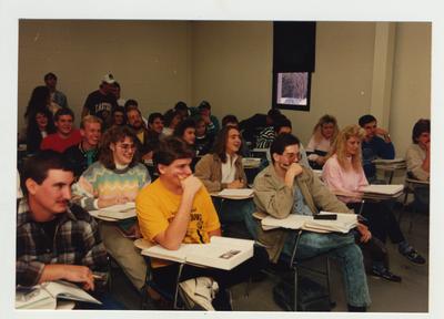 Students listen and laugh during a class