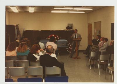 A man speaks at a workshop on grief