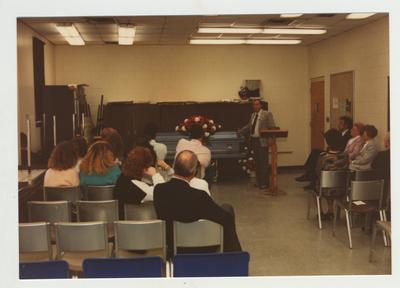 A man speaks at a workshop on grief