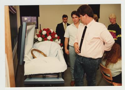 A group of people participate in a workshop on grief