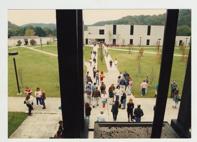A view of students on campus from the windows of an unidentified building