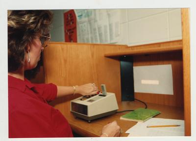 A female student studies in the library